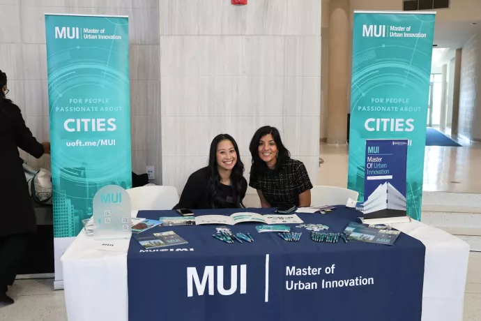 two staff at the urban innovation table