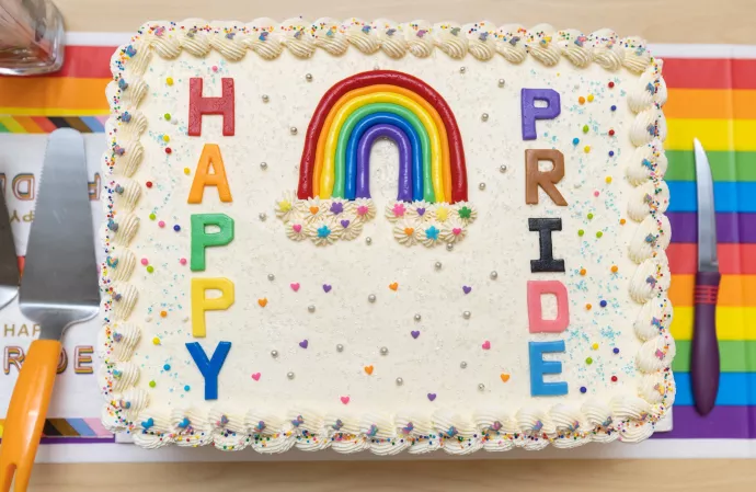 Cake reads Happy Pride in multi-coloured icing