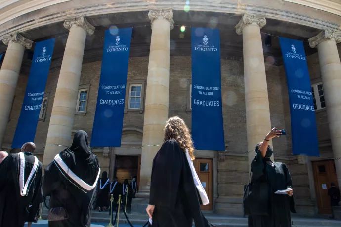 Grads line up outside Convocation Hall