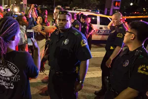 Police and protesters in Dallas on July 7, 2016, after one person is arrested 
