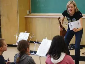 Ukelele teacher and musician Melanie Doane leads students through a Uschool class