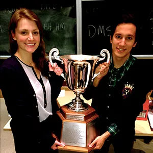U of T students Kaya Ellis and Louis Tsilivis holding championship trophy