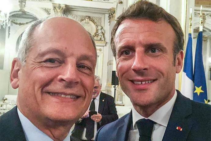U of T President Meric Gertler snaps a selfie with French President Emmanuel Macron