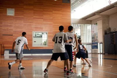 Students playing basketball in the RAWC