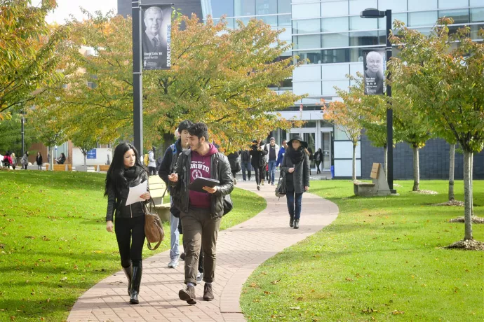 Students walking along campus pathway
