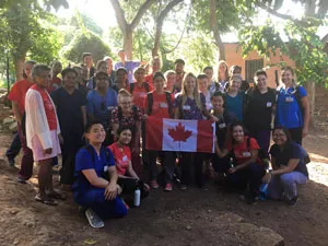 A group of students and community members pose for the camera in Honduras