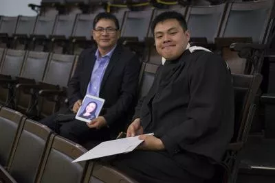 Bill Bin Yang and his son Tony Yuhao Yang at Convocation Hall on June 7, 2017. They brought a photo of Tony's mom, Anna Hongtao Jiang, who died of cancer last year