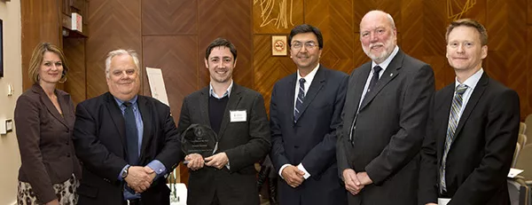 Patrick Gunning (holding award) at the Inventors of the Year ceremony