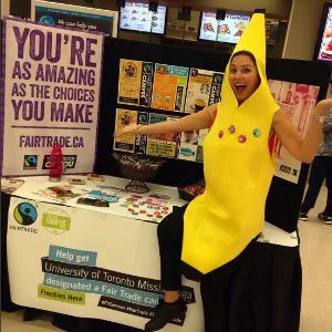 woman wearing a banana costume and sitting on a table