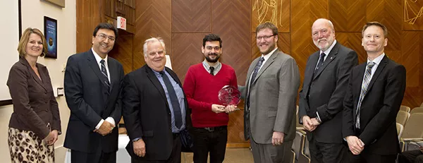 Daniel Wigdor (in suit, to the right of the award) at the Inventors of the Year ceremony