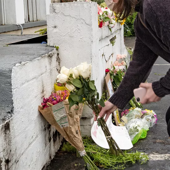 Mourners leave flowers at one of three spas in the Atlanta