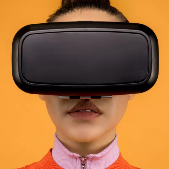 Close up of woman wearing black VR goggle headset