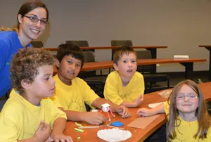 Jenna Friedt (in blue) with camp kids from Sunshine Children's Centre