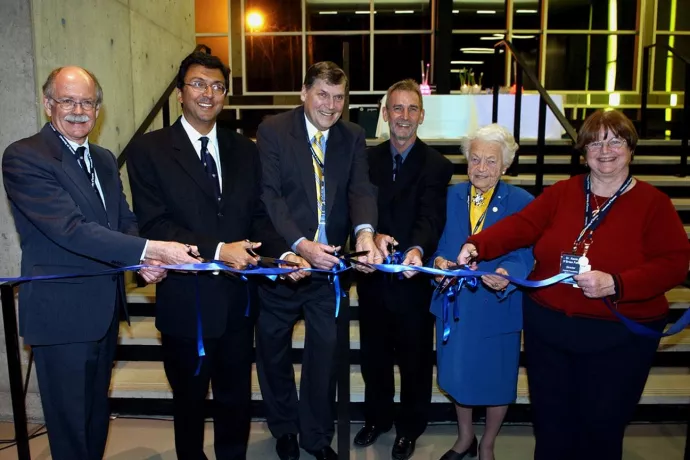 Photo of Ian Orchard and others at a ribbon-cutting ceremony.