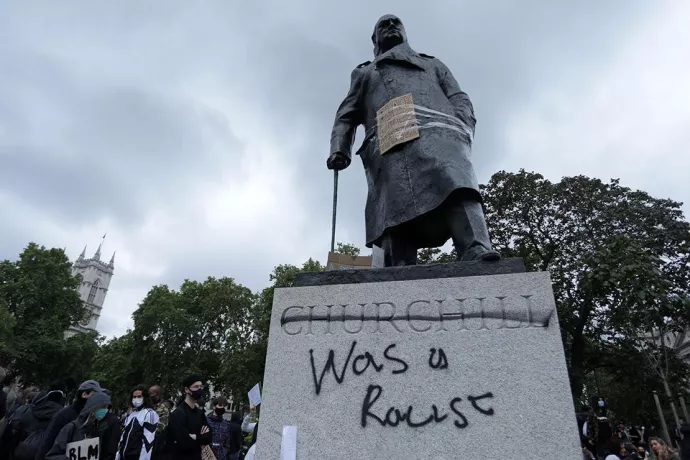 Statue to Churchill with graffiti, stating that he was a racist