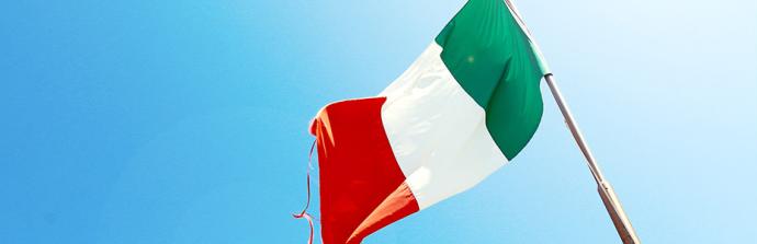Italian flag flying against a clear blue sky