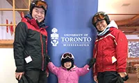 A family dressed in ski gear