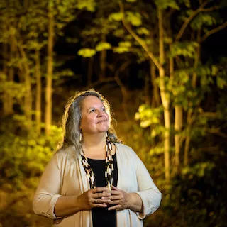 Photo of Dr. Robin Wall Kimmerer in nature