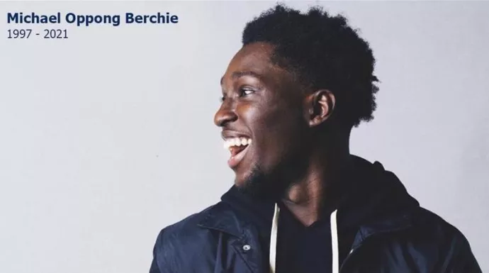 Photo of Michael Berchie laughing facing the left. Text on upper left reads Michael Oppong Berchie (1997-2021)