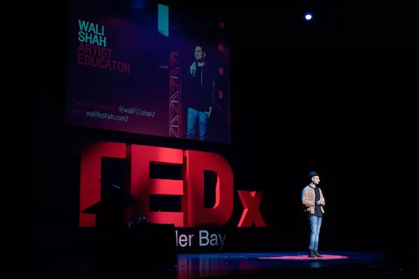 Wali Shah speaking at a TEDx event