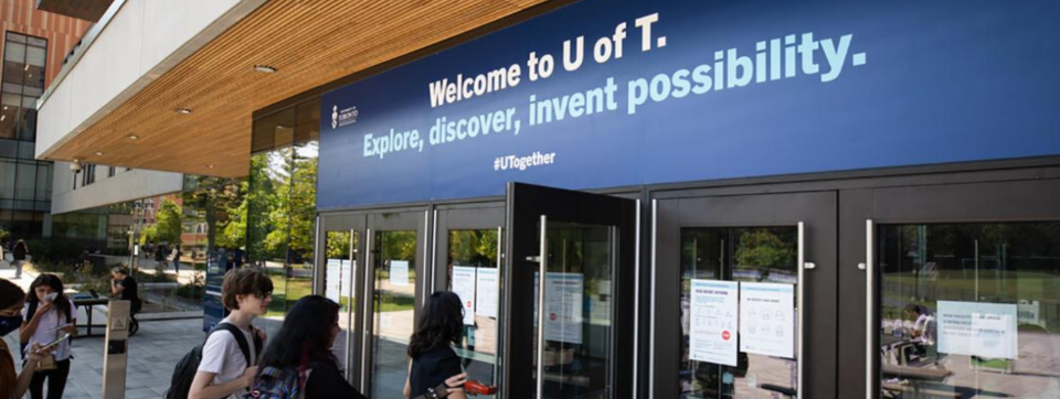 students entering a building. Text above doors read "Welcome to U of T. Explore, discover, invent possibility. #UTogether." 