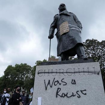 Statue to Churchill with graffiti, stating that he was a racist