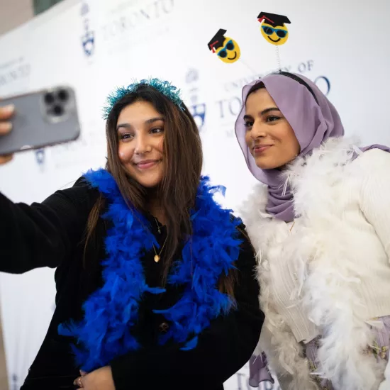 friends taking a selfie at the photobooth