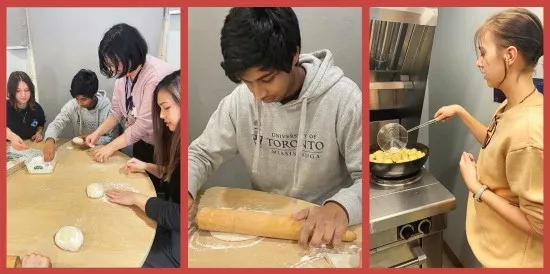 Students roll dough and cook food at a stove.​