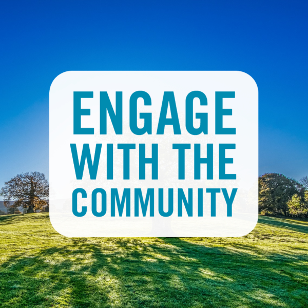 engage with the community over blue sky and grass on a sunny day