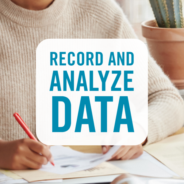 record and analyze data over close up of person's hand writing on paper