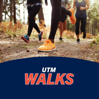 Group running on a trail with text "UTM Walks"