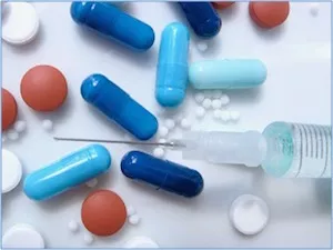 pill capsules and a syringe