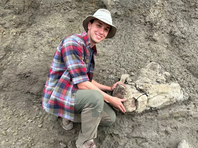 pic of Ethan Mooney holding a fossil