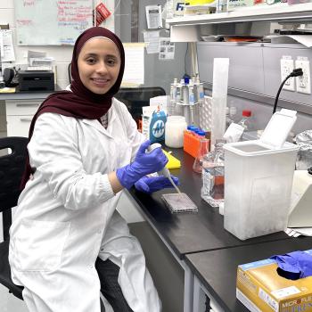 Areej Al Dailami picture, in the lab, wearing a labcoat