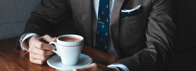 Host page for JSP, image of man in brown tweed suit sitting with a cup of coffee
