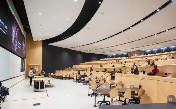 U of T lecture hall with physically distanced students in attendance