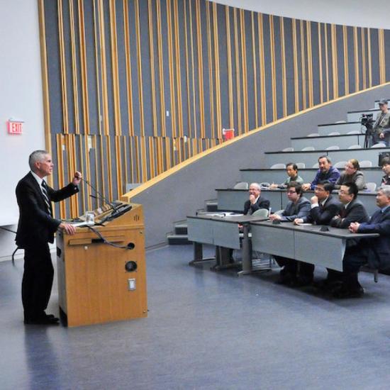 A professor lecturing in a UTM classroom in IB