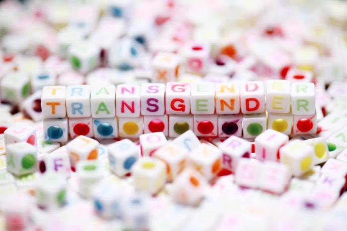 Colourful cubes that spell out the word "Transgender"