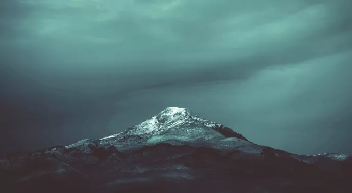 A photo of a dark and gloomy glacier - photo by Pexels