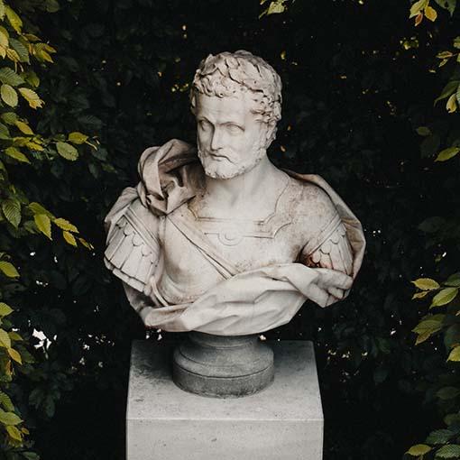 Classical marble bust sculpture. Photo by Mike Gorrell on Unsplash