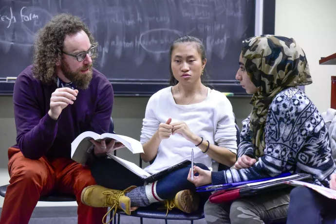 Students in a discussion with faculty