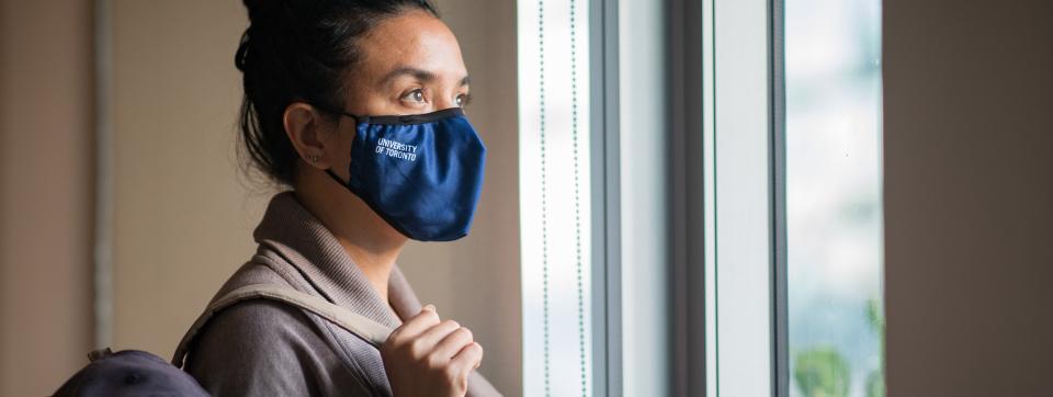 Female with blue mask, with the text, University of Toronto Mississauga