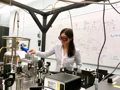 Luyi Yang, physics professor, working in a laboratory