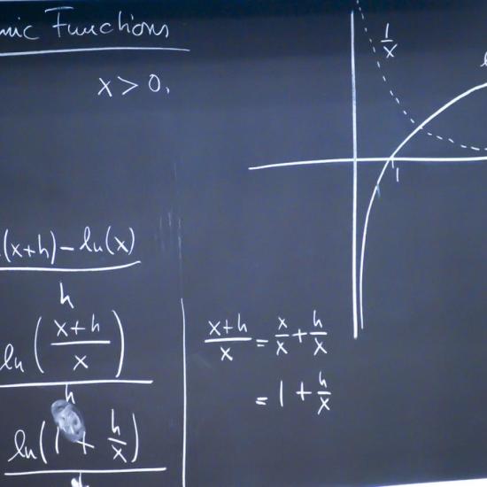A blackboard with a formula written on it