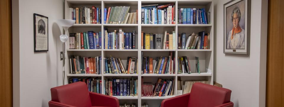 Two red chairs in a book alcove