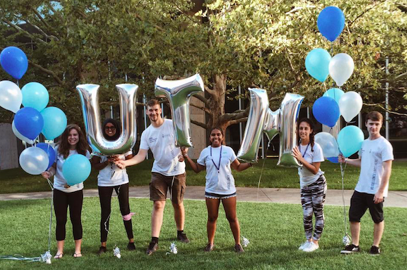 Residence Student Staff members with balloons that read UTM