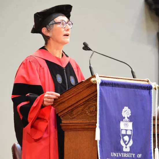 Professor speaking at a podium