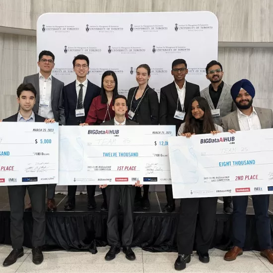 Winners of the Big Data case competition with cheques