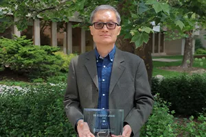 Yue Li with his IMI award