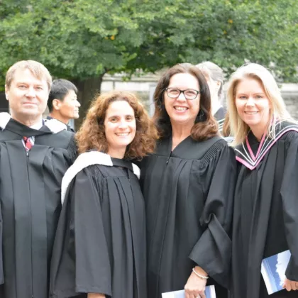 Irene at convocation with three staff in their gowns